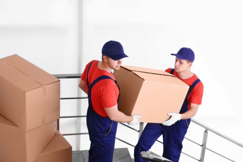 Removal van and moving crew preparing a local move in Fortis Green