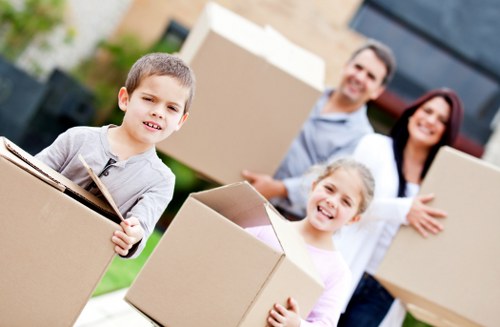 Removal crew carefully loading furniture for a North London relocation
