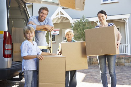 Local van service helping with boxed household items in Fortis Green