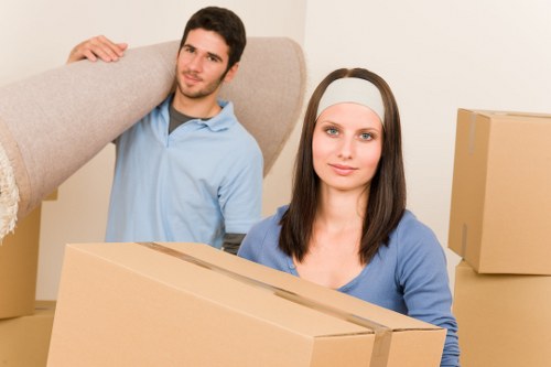Man and van transporting office items for a Fortis Green business