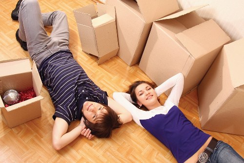 Removal team loading boxes and furniture for a North London house move